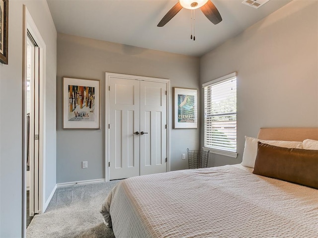 4133 Carmina Dr, Edmond, OK 73034 - bedroom featuring carpet flooring, baseboards, a closet, and ceiling fan