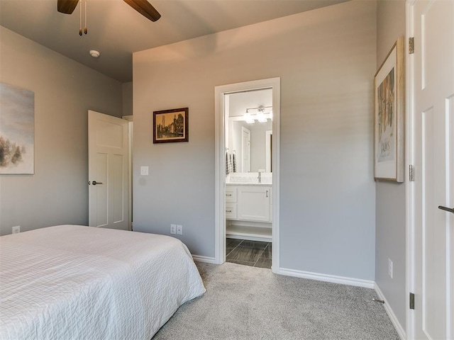 4133 Carmina Dr, Edmond, OK 73034 - carpeted bedroom featuring baseboards, a sink, ensuite bathroom, and a ceiling fan