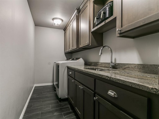 4133 Carmina Dr, Edmond, OK 73034 - laundry area with washer and dryer, cabinet space, and baseboards