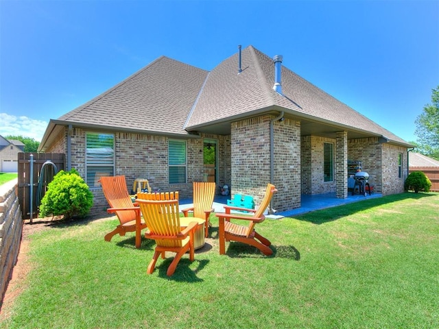 4133 Carmina Dr, Edmond, OK 73034 - rear view of house with brick siding, a shingled roof, and a patio area