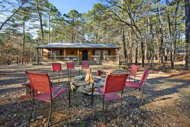 47 Sockeye Rd, Broken Bow, OK 74728 - covered porch featuring an outdoor fire pit