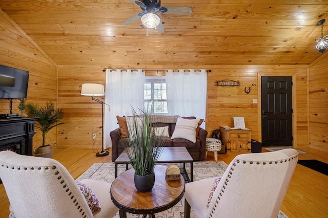 47 Sockeye Rd, Broken Bow, OK 74728 - living room featuring vaulted ceiling, wooden walls, ceiling fan, wood ceiling, and wood finished floors