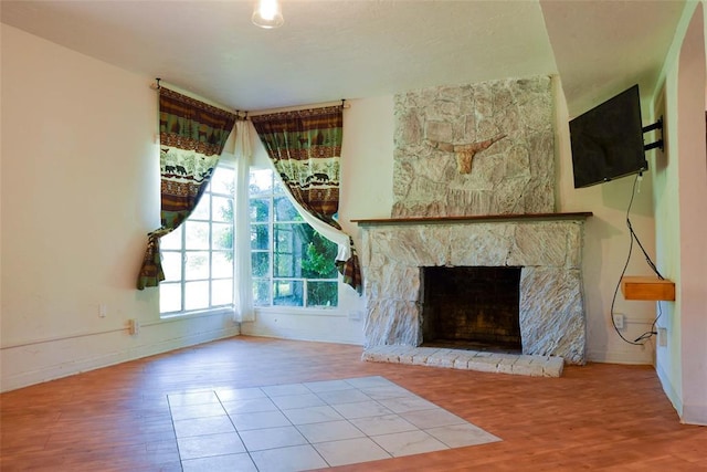 723 W Leslie St, Pauls Valley, OK 73075 - unfurnished living room featuring wood finished floors, baseboards, and a fireplace