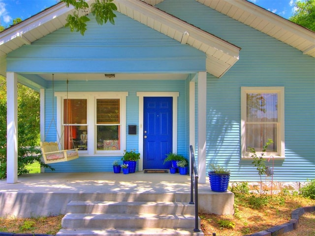 doorway to property featuring a porch