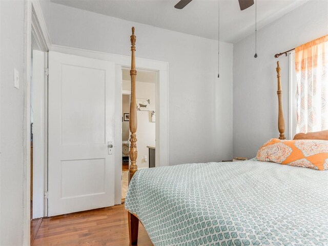 bedroom with wood finished floors and a ceiling fan