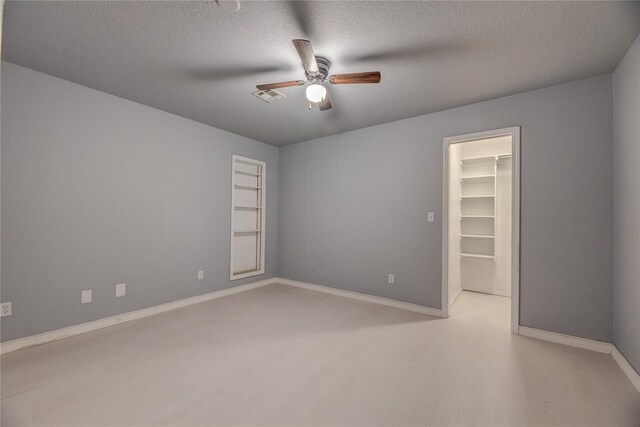 16070 N County Road 3264, Pauls Valley, OK 73075 - unfurnished room with ceiling fan, a textured ceiling, and baseboards