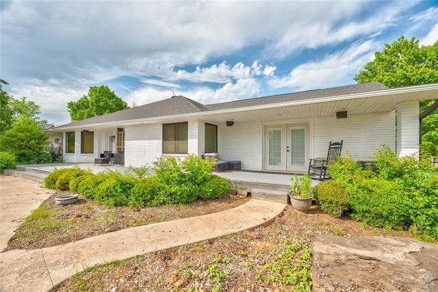 16070 N County Road 3264, Pauls Valley, OK 73075 - back of property with french doors, roof with shingles, and brick siding