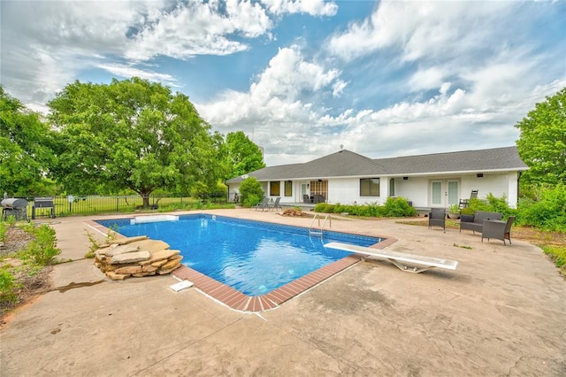 16070 N County Road 3264, Pauls Valley, OK 73075 - view of swimming pool with a patio area, a diving board, french doors, and fence