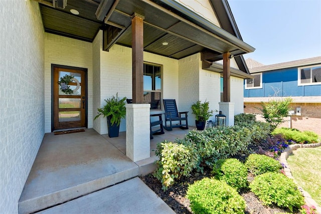 8624 Grey Wind Way, Arcadia, OK 73007 - doorway to property with covered porch and brick siding