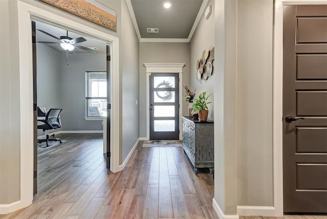 8624 Grey Wind Way, Arcadia, OK 73007 - entrance foyer featuring wood finished floors, crown molding, baseboards, and a ceiling fan