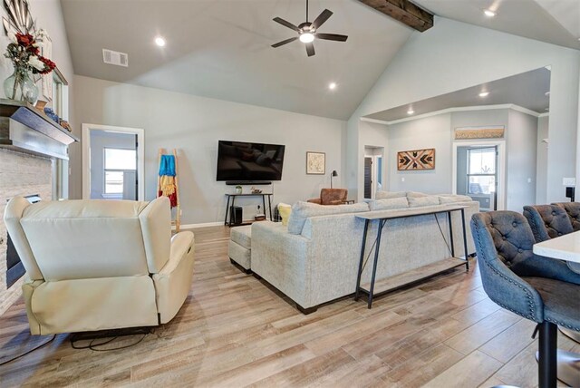 8624 Grey Wind Way, Arcadia, OK 73007 - living room featuring light wood finished floors, ceiling fan, beamed ceiling, healthy amount of natural light, and baseboards