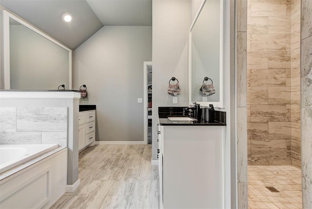 8624 Grey Wind Way, Arcadia, OK 73007 - bathroom with vanity, a garden tub, a tile shower, vaulted ceiling, and recessed lighting