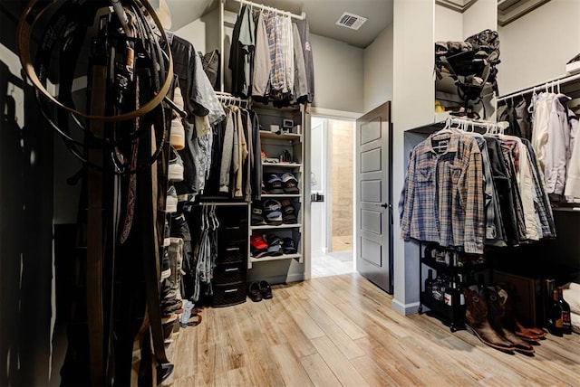 8624 Grey Wind Way, Arcadia, OK 73007 - spacious closet featuring wood finished floors