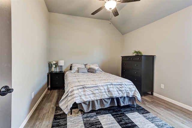 8624 Grey Wind Way, Arcadia, OK 73007 - bedroom featuring wood finished floors, baseboards, vaulted ceiling, and a ceiling fan