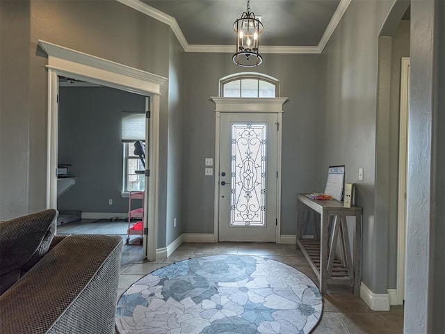 2145 Sycamore Creek Ave, Yukon, OK 73099 - entryway featuring arched walkways, ornamental molding, baseboards, a chandelier, and light tile patterned flooring