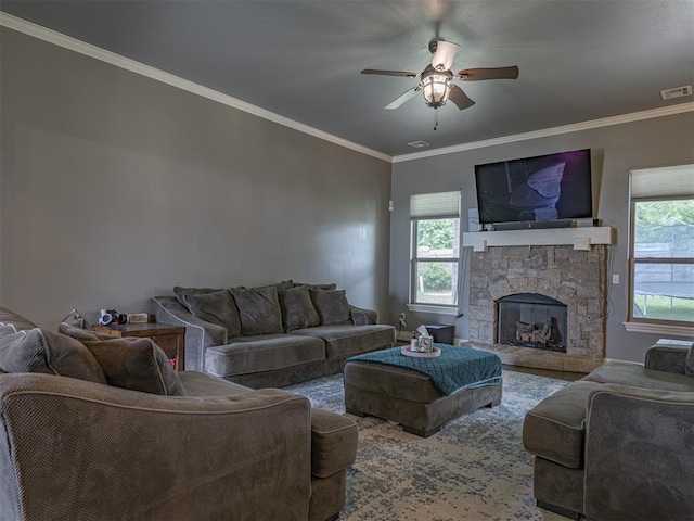 2145 Sycamore Creek Ave, Yukon, OK 73099 - living room with ceiling fan, ornamental molding, and a stone fireplace