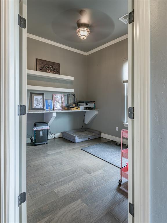 2145 Sycamore Creek Ave, Yukon, OK 73099 - office with ornamental molding, wood finished floors, and baseboards