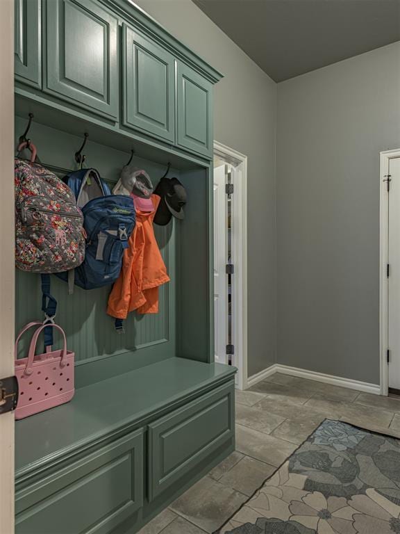2145 Sycamore Creek Ave, Yukon, OK 73099 - mudroom with baseboards and light stone finish flooring