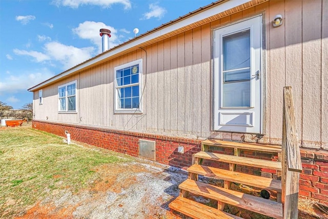 20930 E 1060th Rd, Canute, OK 73626 - view of side of home with entry steps, a lawn, and crawl space