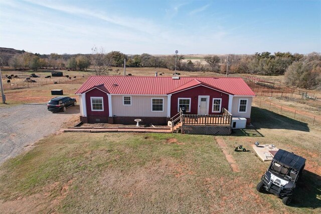 20930 E 1060th Rd, Canute, OK 73626 - single story home featuring metal roof, a wooden deck, and crawl space
