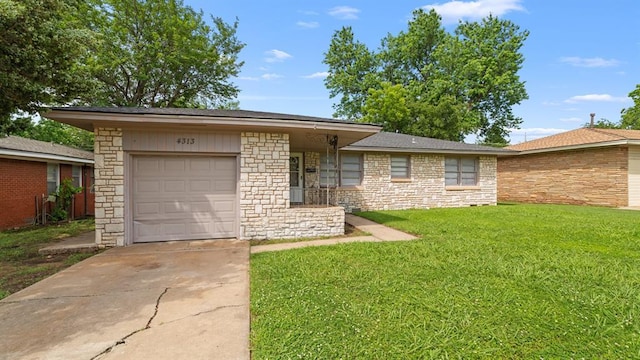 4313 SE 13th St, Oklahoma City, OK 73115 - view of front of house featuring an attached garage, a front lawn, stone siding, and concrete driveway