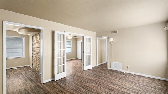 4313 SE 13th St, Oklahoma City, OK 73115 - unfurnished room with french doors, dark wood-style floors, baseboards, and a ceiling fan