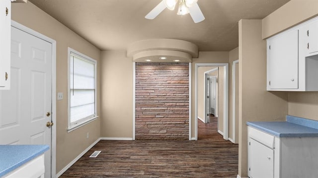 4313 SE 13th St, Oklahoma City, OK 73115 - unfurnished dining area featuring dark wood-style floors, ceiling fan, and baseboards