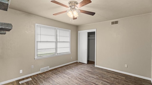 4313 SE 13th St, Oklahoma City, OK 73115 - unfurnished bedroom featuring wood finished floors, baseboards, a closet, and a ceiling fan
