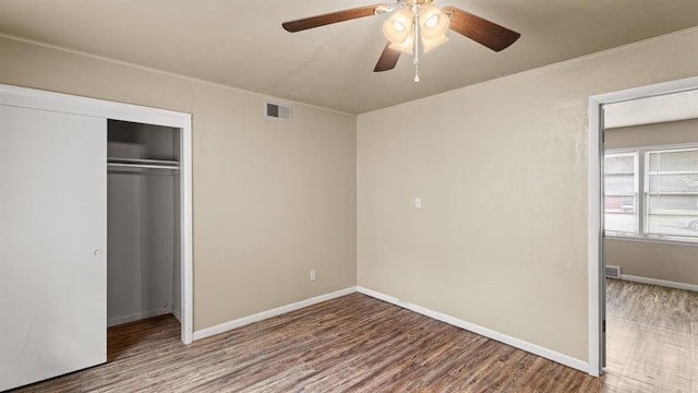 4313 SE 13th St, Oklahoma City, OK 73115 - unfurnished bedroom featuring wood finished floors, a closet, baseboards, and ceiling fan