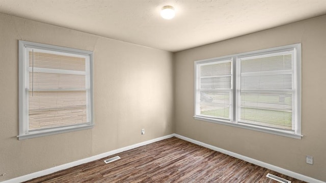 4313 SE 13th St, Oklahoma City, OK 73115 - spare room featuring wood finished floors and baseboards