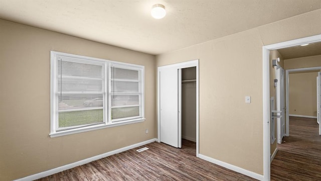 4313 SE 13th St, Oklahoma City, OK 73115 - unfurnished bedroom featuring baseboards, wood finished floors, and a closet