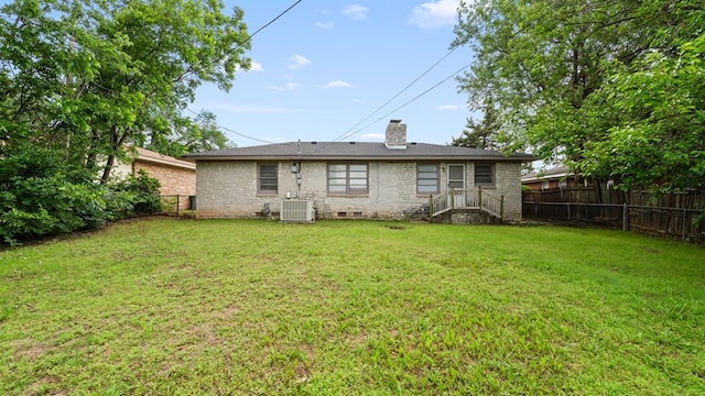 4313 SE 13th St, Oklahoma City, OK 73115 - back of property with a chimney and cooling unit