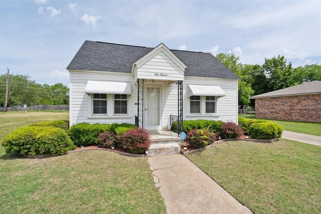 111 E Hughbert St, Norman, OK 73069 - view of front of house featuring roof with shingles