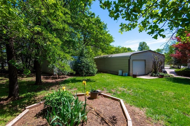 13351 El Zorro, Edmond, OK 73034 - view of yard with a garage, an outdoor structure, and a vegetable garden