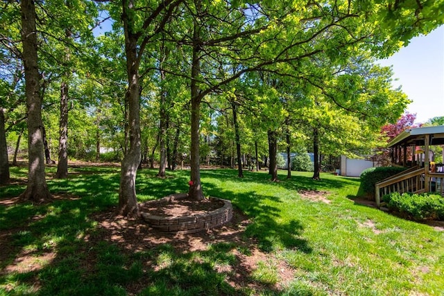 13351 El Zorro, Edmond, OK 73034 - view of green lawn with a storage shed