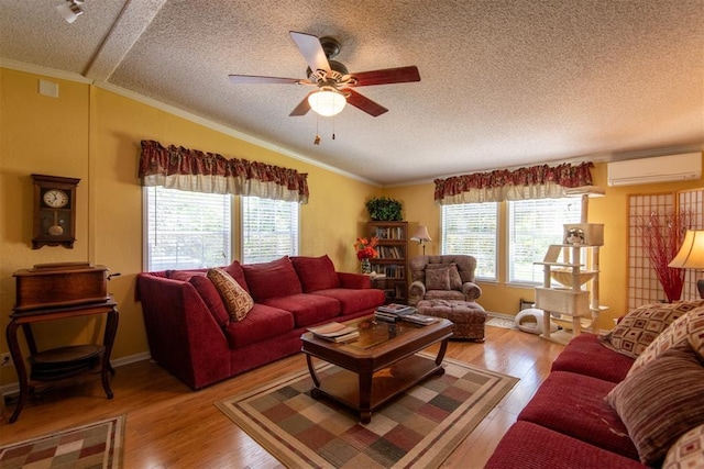 13351 El Zorro, Edmond, OK 73034 - living area with an AC wall unit, plenty of natural light, ornamental molding, a textured ceiling, and ceiling fan