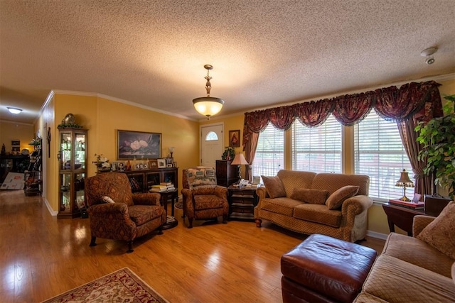 13351 El Zorro, Edmond, OK 73034 - living area featuring a textured ceiling, ornamental molding, and light wood-style floors