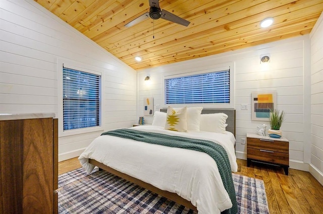 177 Hochapine Trl, Broken Bow, OK 74728 - bedroom with wooden ceiling, lofted ceiling, wood finished floors, wooden walls, and ceiling fan