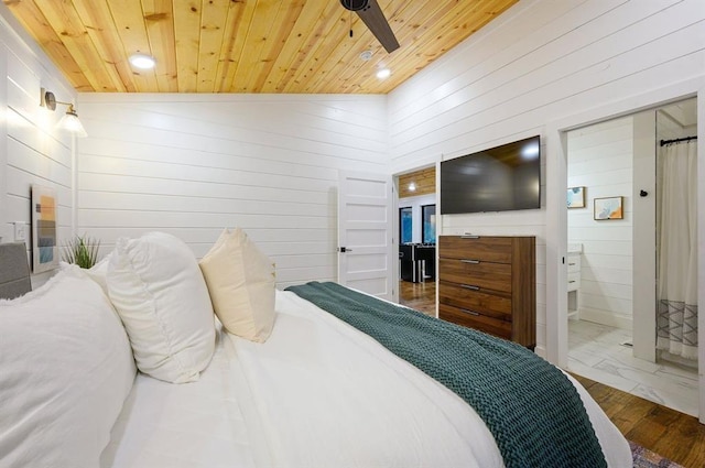177 Hochapine Trl, Broken Bow, OK 74728 - bedroom featuring wooden ceiling, wooden walls, marble look tiles, recessed lighting, and ensuite bathroom