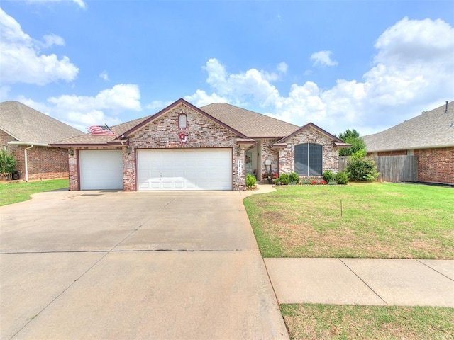 1512 Selborne Pl, Yukon, OK 73099 - view of front of property with an attached garage, driveway, roof with shingles, and brick siding