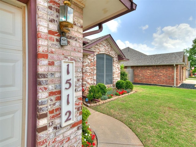1512 Selborne Pl, Yukon, OK 73099 - property entrance featuring brick siding, a lawn, and a shingled roof