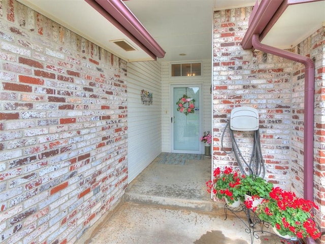 1512 Selborne Pl, Yukon, OK 73099 - view of exterior entry featuring brick siding