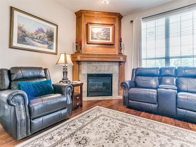 1512 Selborne Pl, Yukon, OK 73099 - living area with wood finished floors and a tiled fireplace