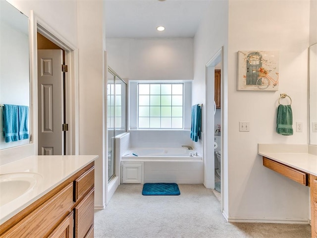 1512 Selborne Pl, Yukon, OK 73099 - bathroom featuring toilet, vanity, a shower stall, a garden tub, and baseboards