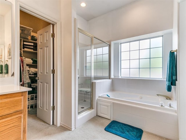 1512 Selborne Pl, Yukon, OK 73099 - full bath with a shower stall, a spacious closet, vanity, and a garden tub