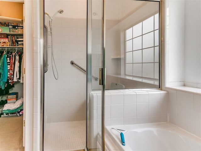 1512 Selborne Pl, Yukon, OK 73099 - full bathroom featuring a stall shower, a garden tub, and a spacious closet