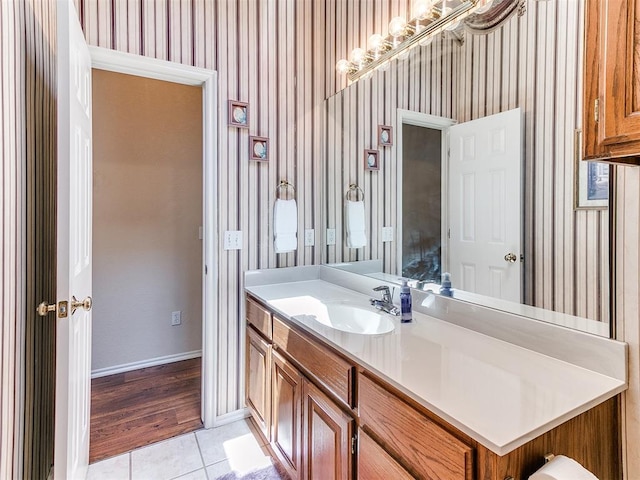 1512 Selborne Pl, Yukon, OK 73099 - bathroom featuring wallpapered walls, tile patterned floors, vanity, and baseboards