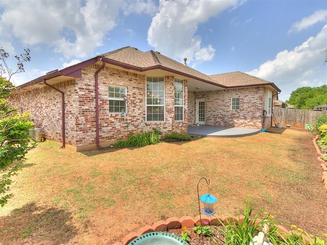 1512 Selborne Pl, Yukon, OK 73099 - rear view of property with a patio area and brick siding