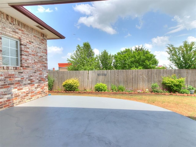 1512 Selborne Pl, Yukon, OK 73099 - fenced backyard with a patio
