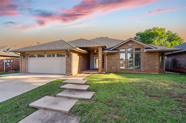 1721 Park View Pl, Edmond, OK 73003 - view of front of property featuring an attached garage, brick siding, driveway, and a lawn